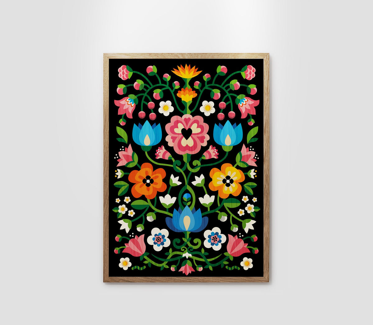 A framed folk art print featuring a vibrant floral pattern on a black background