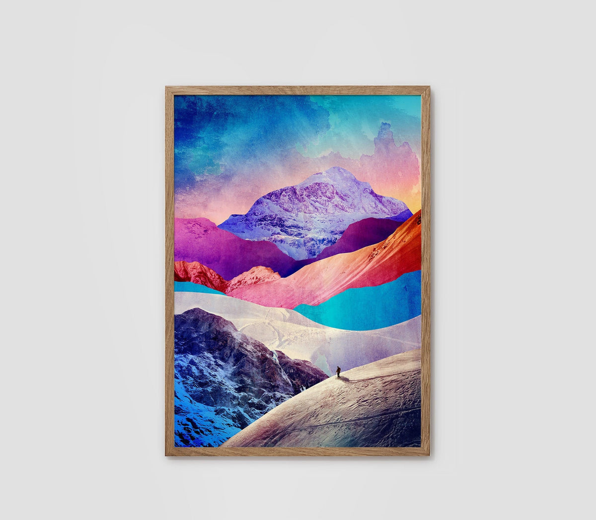 A framed art print depicting a colorful mountain landscape with vibrant shades of blue, pink, purple, and orange, set against a light gray background.