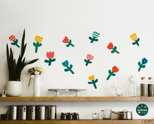 Colorful flower wall decals arranged on a white wall.