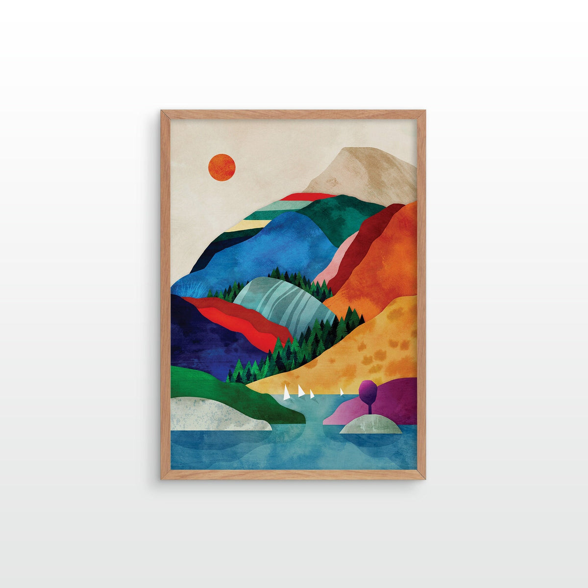 A framed art print featuring a colorful, geometric mountain landscape with a lake, trees, and a sun.
