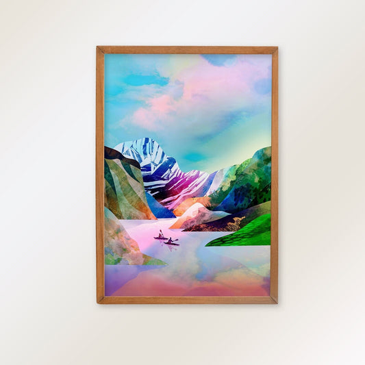 A framed art print depicting a colorful mountain landscape with a lake and small boats, mounted on a light beige wall.