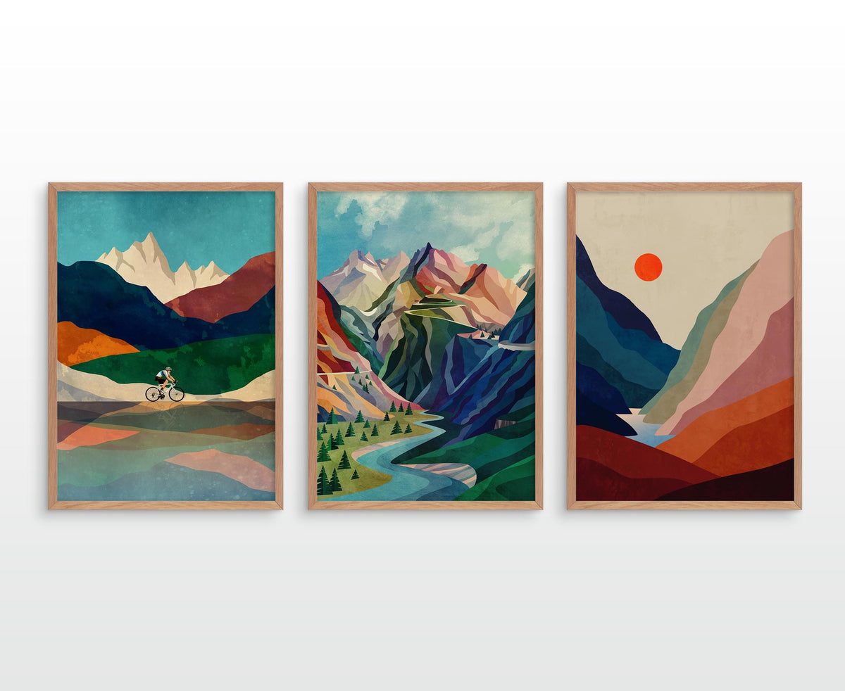 Three framed landscape art prints with a retro geometric style, displayed side-by-side on a light gray wall.