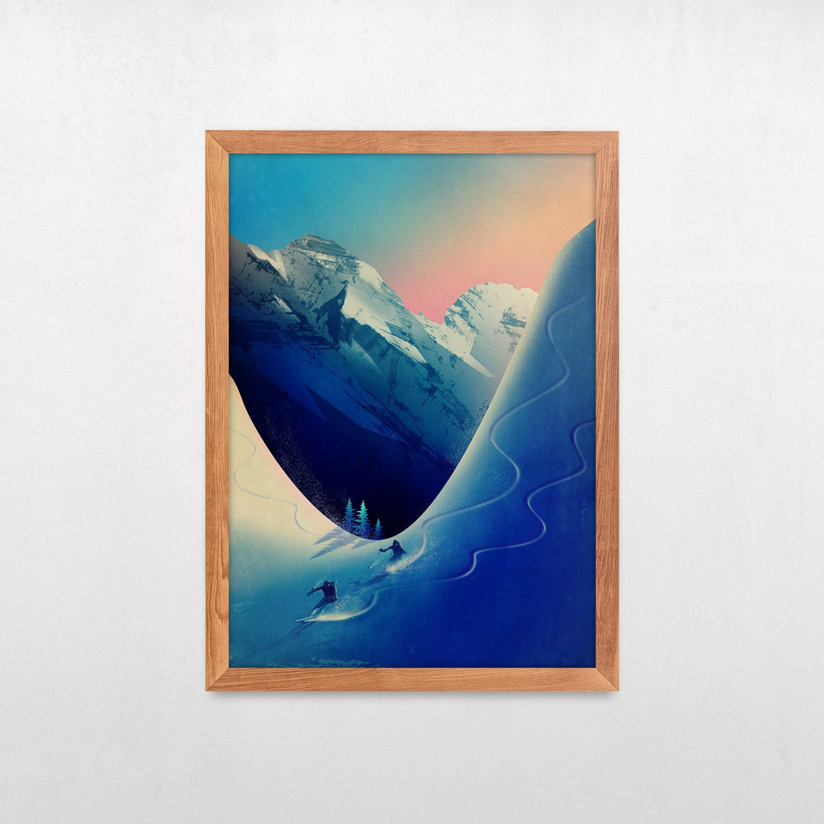 A framed art print featuring a stylized mountain landscape with snow-covered peaks, a curved blue slope, and a small skier in the foreground, displayed against a light gray wall.