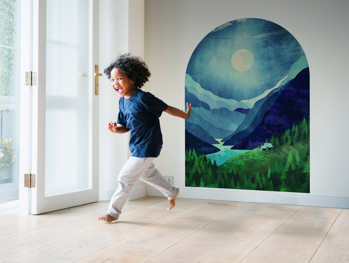 Arched wall mural depicting a mountain landscape at night with a moon and river.