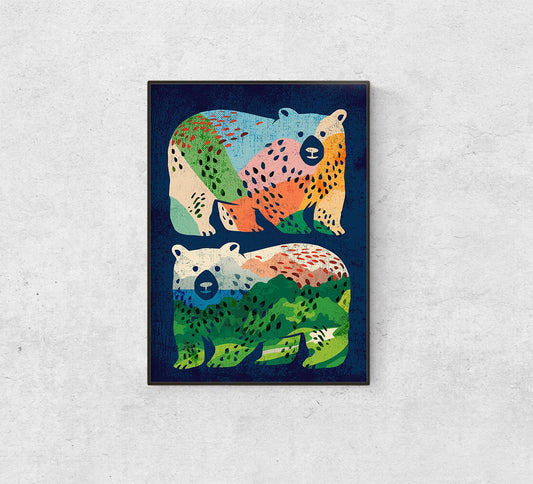 A framed art print featuring two stylized polar bears in a colorful, patterned design on a dark navy background, displayed on a light gray textured wall.