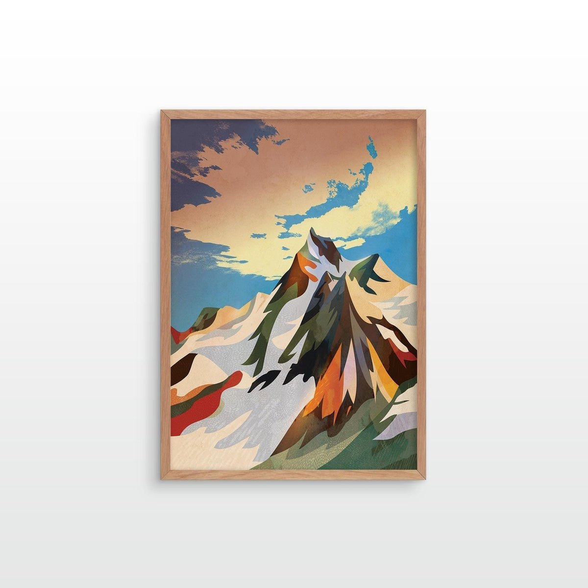 A framed art print featuring a stylized, geometric mountain landscape with snowy peaks under a warm sky, displayed on a clean white wall.